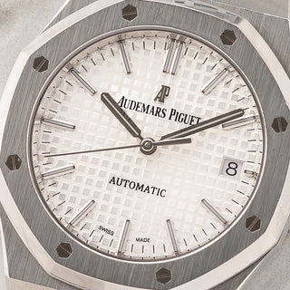 Macro close-up shot of the white Grande Tapisserie pattern dial and applied white gold markers on an Audemars Piguet 15450ST