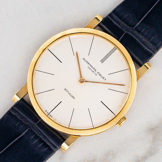 Angled shot highlighting the unpolished 33mm 18k yellow gold case, stick indices, and thin bezel on an Audemars Piguet 5043