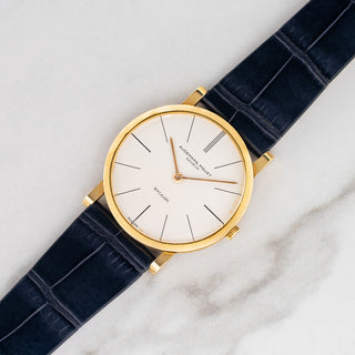 1950s Audemars Piguet Ultra-Thin reference 5043 retailed by Bvlgari in unpolished 18k yellow gold on a blue alligator strap at Collectors Corner NY