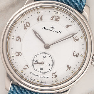 Macro close-up of the white dial, curved Breguet numerals, and small seconds subdial on a Blancpain Villeret Chronometer 7002