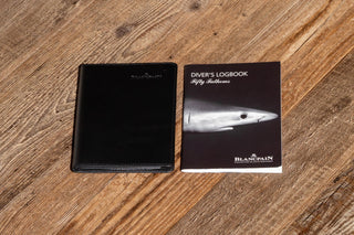 Original Blancpain leather document holder and instruction manual included with the Fifty Fathoms No Rad set