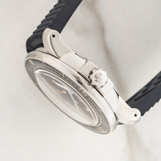 Side profile view showcasing the signed winding crown, crown guards, and domed sapphire bezel edge on a Blancpain Fifty Fathoms
