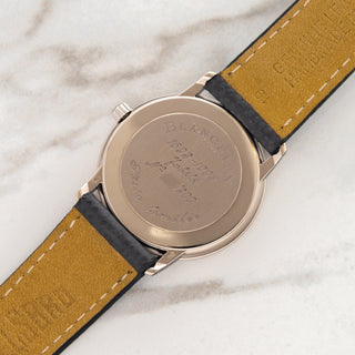 The unpolished 18k white gold caseback showing crisp Jubilee engravings and deep gold hallmarks on a Blancpain 7001