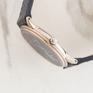 Side profile view showcasing the ultra-slim 18k white gold case, stepped bezel, signed crown, and sapphire crystal on a Blancpain Jubilee