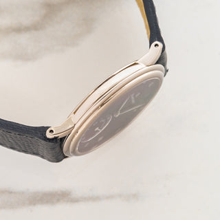 Side profile view displaying the ultra-slim unpolished 18k white gold case architecture and lug design on a Blancpain Ref 7001