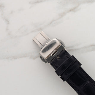 Close-up view of the authentic Blancpain folding deployant clasp attached to a black leather strap