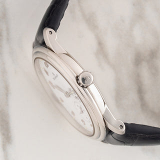 Side view displaying the signed crown, thin lugs, and case architecture on a Blancpain Villeret 1106