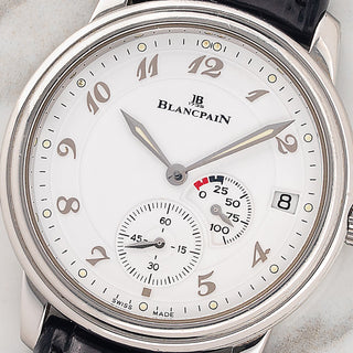 Macro close-up of the white dial, 100-hour power reserve indicator, and raised Breguet numerals on a Blancpain Villeret 1106