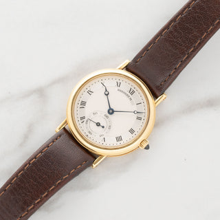 1980s Breguet Classique 3210BA in 18k yellow gold signed Chaumet on a dark brown leather strap at Collectors Corner NY