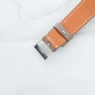 Underside view showing the tan lining and construction of the leather watch strap fitted to a Heuer Carrera