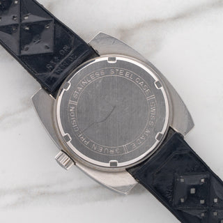 The stainless steel screw-down caseback on a 1970s vintage Gruen Airflight reference 27524