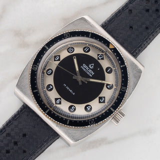 Angled view showing the bi-directional rotating bezel and sharp case lines on a Gruen Airflight 27524