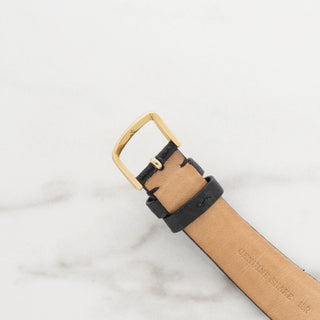 Underside view of the genuine leather watch strap and gold buckle attachment for a vintage Hamilton
