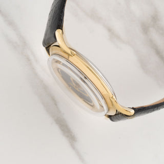 Side view displaying the slim case design and distinctively curved lugs of a 1950s Hamilton Cross Country