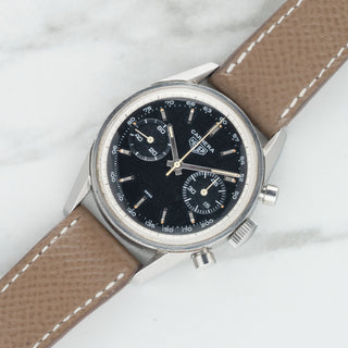 Rare 1963 vintage Heuer Carrera 3647NT unpolished black dial racing chronograph watch on a taupe leather strap at Collectors Corner NY