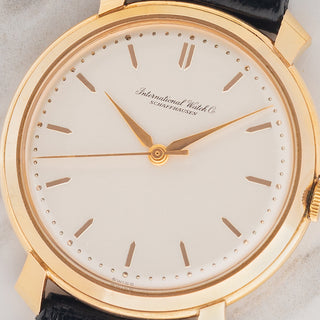 Macro close-up of the pristine original dial, outer pearling minute track, and pink gold hands on an IWC 521