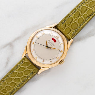 1950s LeCoultre Powermatic in 10k gold-filled with gold Breguet numerals and red power reserve window on an olive alligator strap at Collectors Corner NY