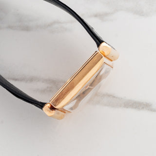 Side profile view displaying the 18k rose gold case profile and hooded lug geometry on a Patek Philippe 1532R