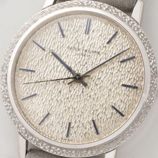 Macro shot of the rare artisanal hammered finish dial and faded blue indices on a vintage Patek Philippe Calatrava 3569