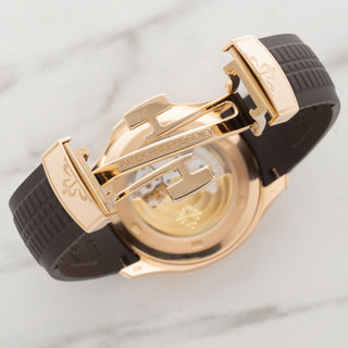 Open view of the rose gold deployment clasp and sapphire crystal exhibition caseback on a Patek Aquanaut 5167R
