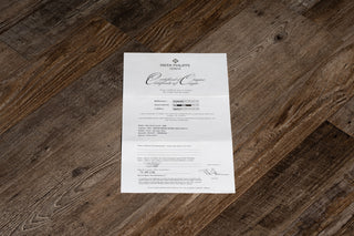 The original open warranty papers accompanying the Patek Philippe Aquanaut 5167R at Collectors Corner NY