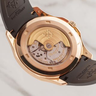 Close-up look at the intricate automatic caliber movement through the exhibition sapphire caseback of a Patek 5167R