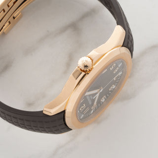Side profile showcasing the slim case architecture and signature winding crown of the rose gold Patek Philippe 5167R