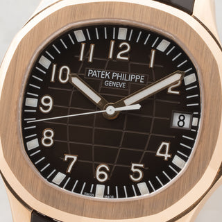 Macro close-up of the brown embossed grenade dial and applied rose gold Arabic numerals on a Patek Philippe 5167R