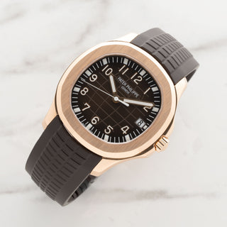 Patek Philippe Aquanaut reference 5167R in 18k rose gold with a textured brown embossed dial and rubber strap at Collectors Corner New York