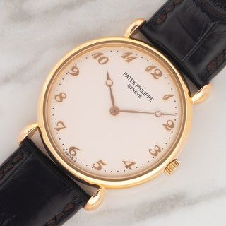 Angled shot highlighting the distinctive 18k rose gold teardrop lugs and Breguet numeral dial on a Patek Philippe Calatrava 3820R