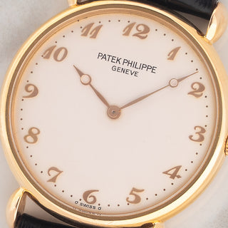 Macro close-up shot of the brushed silver dial, applied rose gold Breguet numerals, and matching Breguet hands on a Patek Philippe 3820R