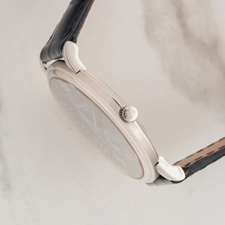 Side profile view showcasing the slim platinum officer case lines and winding crown of a Patek Philippe 5022P