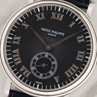 Macro close-up shot of the black hobnail guilloché dial, white gold Roman numerals, and small seconds register on a Patek Philippe 5022P