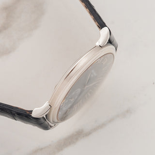 Side view displaying the officer style case profile and straight lug construction on a platinum Patek Philippe 5022P