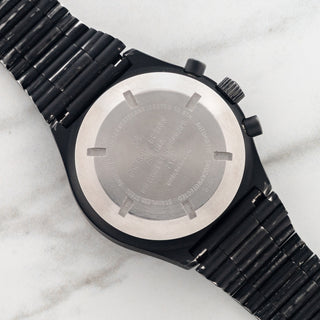 Stainless steel caseback displaying military issue serial engravings on a Porsche Design Orfina reference 7177