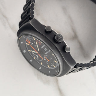 Side profile view showcasing the black PVD case, crown, and Lemania 5100 chronograph pushers on a Porsche Design Orfina