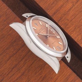 Angled top view highlighting the sharp lug proportions and smooth bezel on a 1995 Rolex Air-King 14000