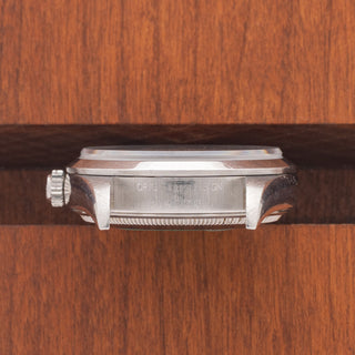 Horizontal case profile showing the winding crown and clear W serial number engraving between the lugs of a 1995 Rolex Air-King