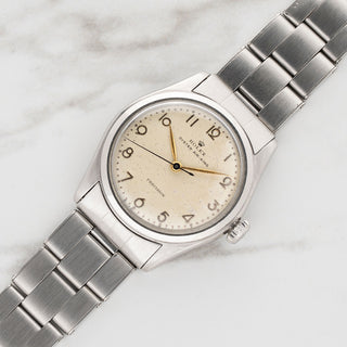Vintage Rolex Air King 4499 stainless steel watch with rare cream Arabic numeral dial on oyster bracelet at Collectors Corner New York
