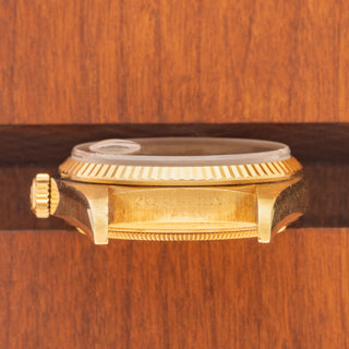 Horizontal case profile showing the clear 16018 reference number engraving and unpolished 18k gold case edges