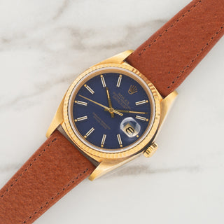 1984 Rolex Datejust reference 16018 in 18k yellow gold with matte blue dial on a brown leather strap at Collectors Corner NY
