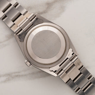 The clean, brushed stainless steel Oyster caseback and lug undersides of a Rolex Datejust 16200.