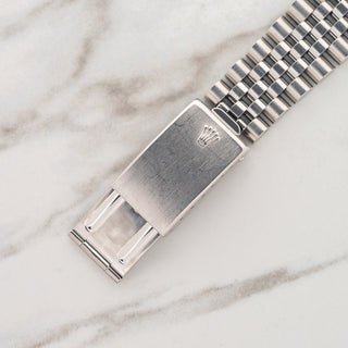 Close-up view of the stainless steel folding clasp showing a crisp Rolex coronet on a Jubilee bracelet