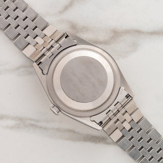 The clean stainless steel Oyster caseback and brushed lug undersides on a 1999 Rolex Datejust reference 16234