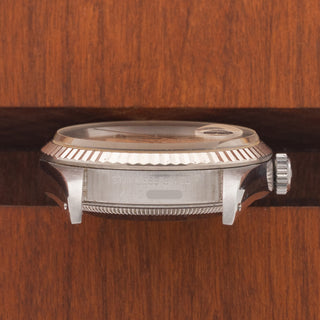 Horizontal case profile showing the winding crown and clear X serial number engraving between the lugs of a 1991 Rolex Datejust