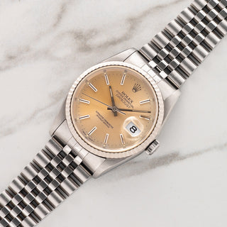 1991 Rolex Datejust reference 16234 with tropical peach sunburst dial and 18k white gold fluted bezel on a Jubilee bracelet at Collectors Corner NY
