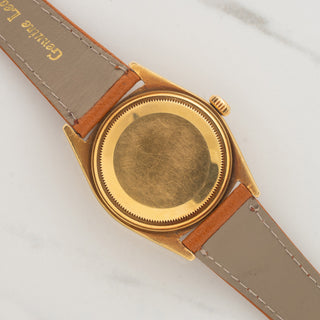 The clean 18k yellow gold Oyster caseback and lug undersides on a vintage Rolex Day-Date 1806