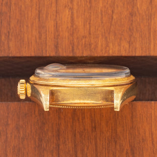 Horizontal case profile showing the clear serial number engraving between the lugs of a 1965 Rolex Day-Date