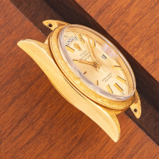 Angled top view highlighting the well-preserved 18k gold lug proportions and Florentine texture on a vintage Rolex Day-Date