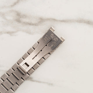 Inside view of the authentic 18k white gold integrated folding clasp mechanism and Rolex hallmarks